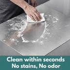 Person cleaning a stainless steel cutting board with a cloth