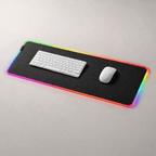 Large black keyboard and mouse pad with RGB lighting on a gray surface, featuring a keyboard and mouse.